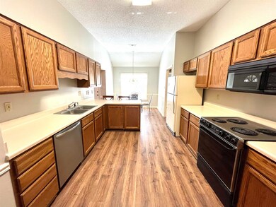 Large wide entry from Dining to Kitchen area with 