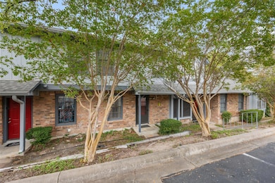 Ranch-style house with brick siding and roof with shingles
