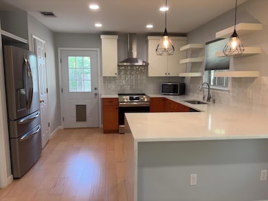 Kitchen featuring appliances with stainless steel