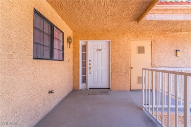 Entrance to property with stucco siding