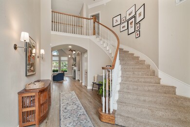 Grand, carpeted staircase leading to the second-fl