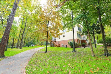 Side yard showing rear aggregate driveway leading