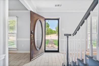 Entrance foyer featuring light tile flooring and p
