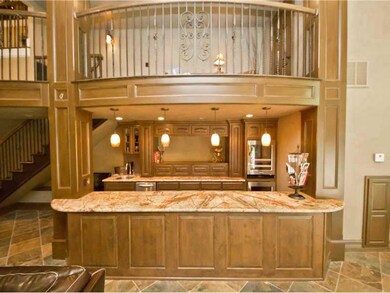 Den/Family/Great Room. Huge bonus room downstairs, with full bar /kitchenette, French doors leading out to the pool