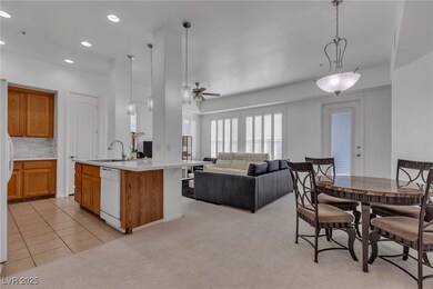 Kitchen with open floor plan, a ceiling fan, brown