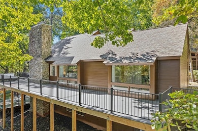 Back of property with a deck