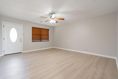 Foyer with ceiling fan, baseboards, visible vents,