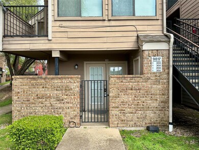 View of exterior entry featuring brick siding