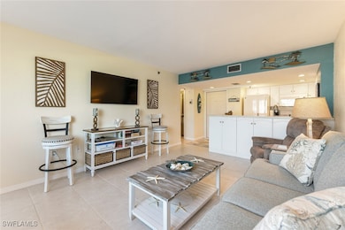 Living room featuring light tile patterned floors,