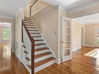 Entryway with hardwoods & plenty of natural light