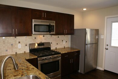 The door from the kitchen opens to a 21X 13 wood d