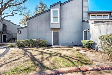 View of front of house featuring stairway and stuc
