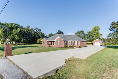 Large concrete driveway with ample space for parking additional vehicles.  Convenient access to nearby schools, shopping, restaurants & recreational facilities.