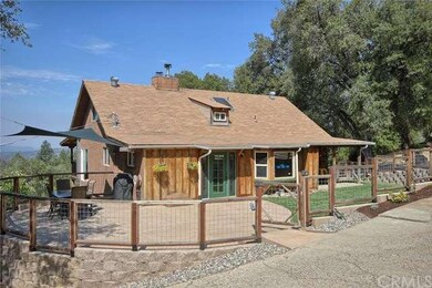 Front exterior ... fenced in area with lawn