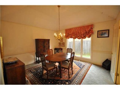Fine dining in a room which offers a coffered ceil