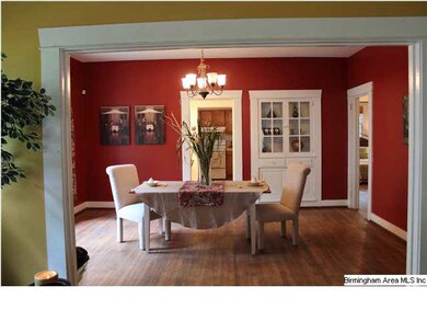 Dining room with hardwood floors and large opening