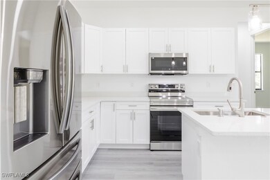 Kitchen featuring a sink, stainless steel applianc
