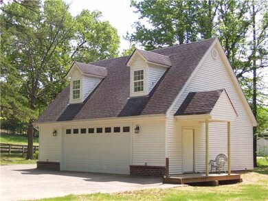 Great double garage with porch and nice upstairs r