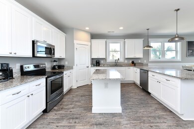 Kitchen with stainless steel appliances, sink, a k