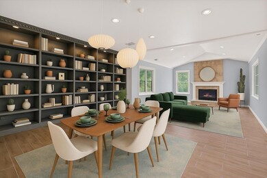 Dining room with wood finish floors, vaulted ceil