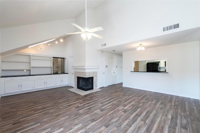 Unfurnished living room featuring ceiling fan, rai