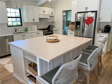 Stainless steel appliances and a gas stove complem