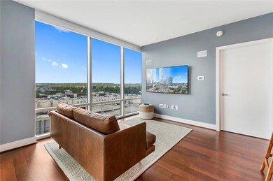 Living room featuring expansive windows, wood fin