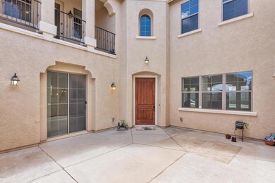 Front entry in gated front courtyard