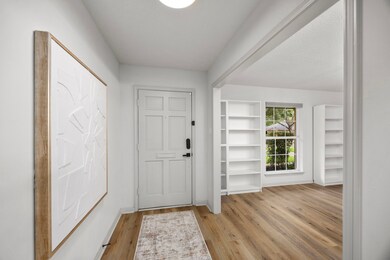 Luxury vinyl plank flooring throughout.