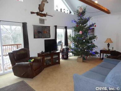Great Room. Twin Sliding Doors open out to a large