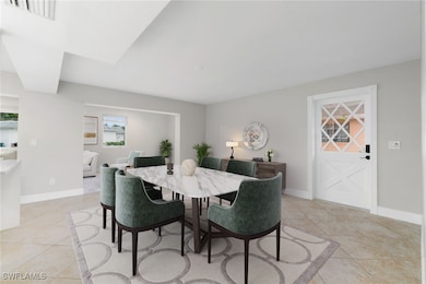 Dining space featuring light tile patterned floors