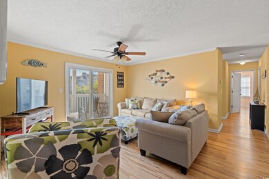 Living room featuring ornamental molding, plenty o