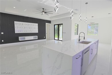 Kitchen featuring dishwasher, open floor plan, mod