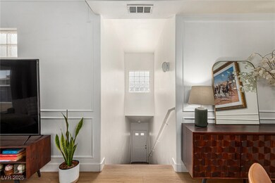 Entryway featuring visible vents and wood finished