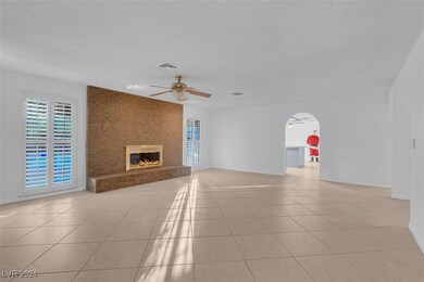Living room with view of pool and covered patio th