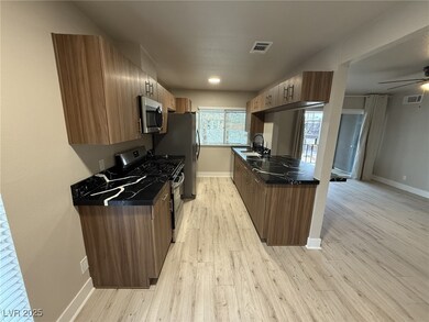 Kitchen with appliances with stainless steel finis