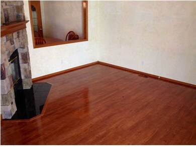 Enter the living room with beautiful wood floors!