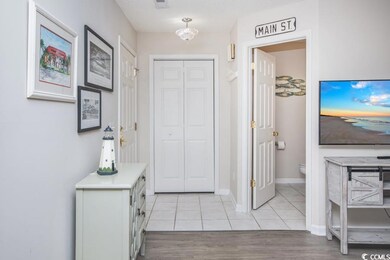 Entrance foyer featuring light tile patterned floo