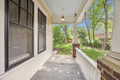 The wrap around porch opens to the back yard