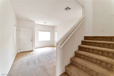 Second photo of living room, entrance. Stairs to s