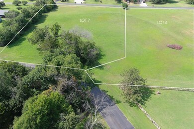 Aerial view of property's location featuring property parcel outlined
