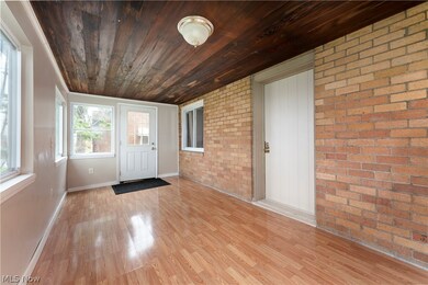 Unfurnished sunroom with wooden ceiling