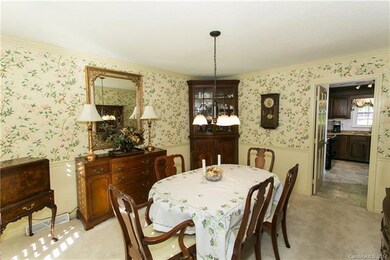 The bright, spacious, formal dining room is locate