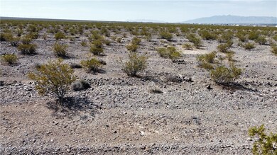 View of local wilderness featuring a rural view, a mountain view, and a desert view