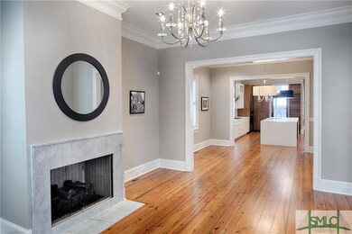 Formal living room with gas fireplace. Open to the