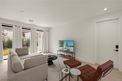 Living room with light hardwood / wood-style floor