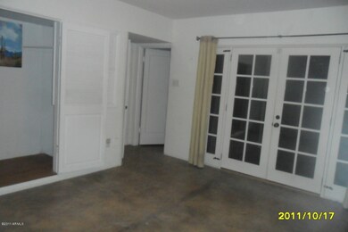 French door lead to lush backyard
