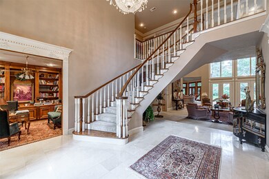 The stunning grand foyer welcomes you into the hom