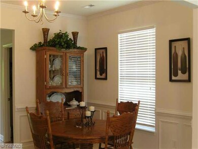 Dining Room. Dining Room with Crown Molding, Chair Rail and Wainscotting