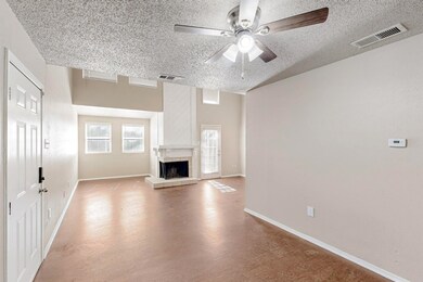Unfurnished living room featuring visible vents, b